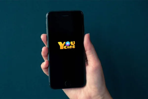 imgi_238_2025110510363774-600x400 Promotional image for Youcine app displaying various movie stars alongside a collection of films for streaming.